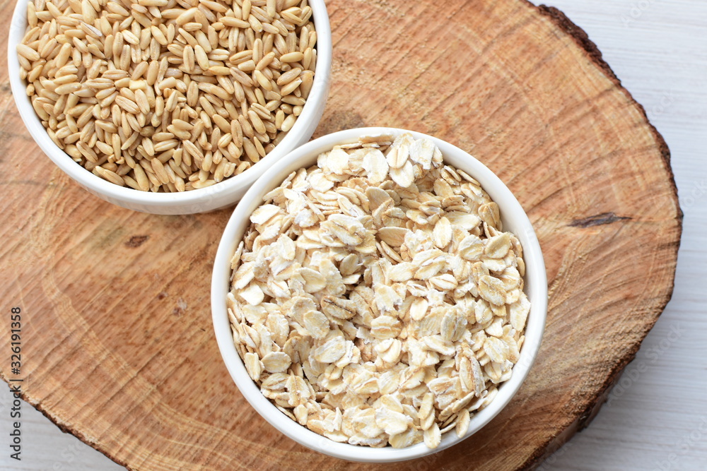 Oat grains and flakes in containers for display Oat grains and flakes in containers for display