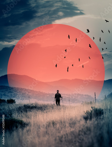 Man walks in field, surreal image