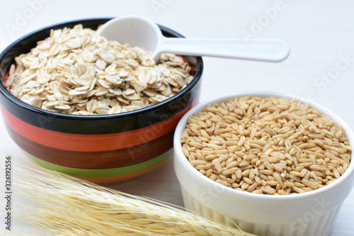 Oat grains and flakes in containers for display