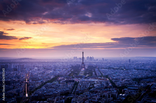 skyline of Paris with Eiffel Tower at sunset in Paris, France. Eiffel Tower is one of the most iconic landmarks of Paris.