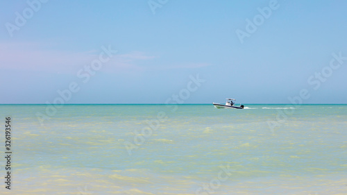 Calm ocean with boat, Florida, USA