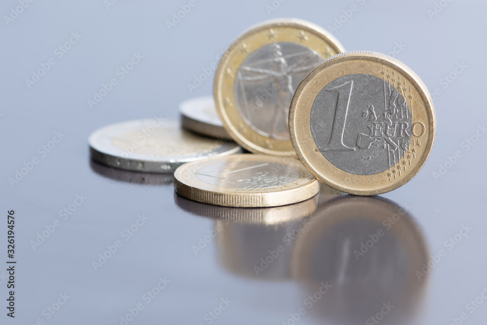 Close up euro coins. Currency of the European union on blurred background Close up euro coins. Currency of the European union on blurred background