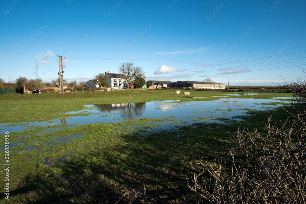 Farm with flood water on fields