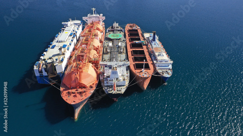 Aerial drone photo of old industrial tanker ships docked of shore near Mediterranean destination port
