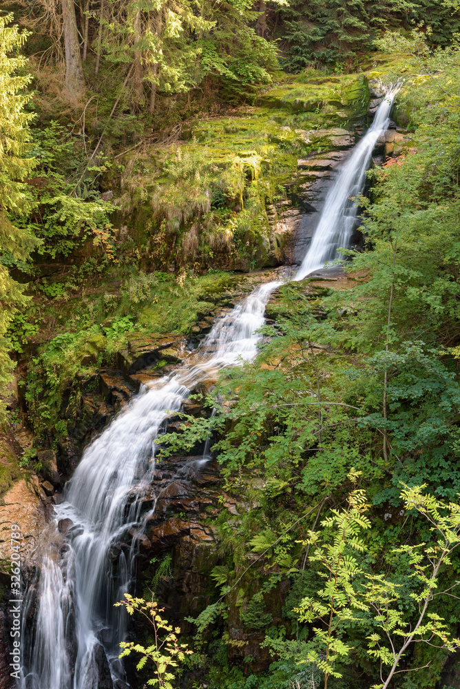 Naklejka premium Blurred water of waterfall of Kamienczyk river in Poland