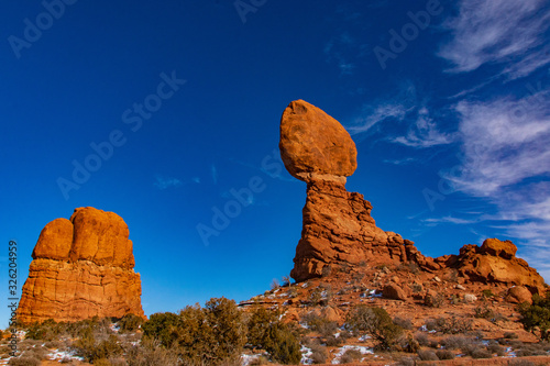 Canvas Print Clouds and Balanced Rock in Arches National Park