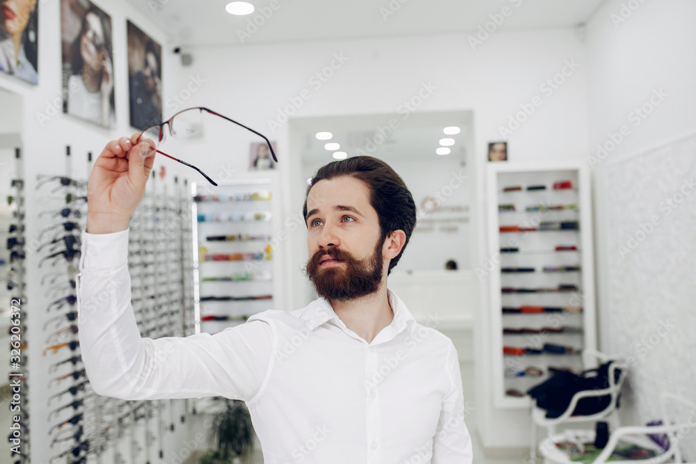 Man in a glasses. Guy in a optics shop Man in a glasses. Guy in a optics shop