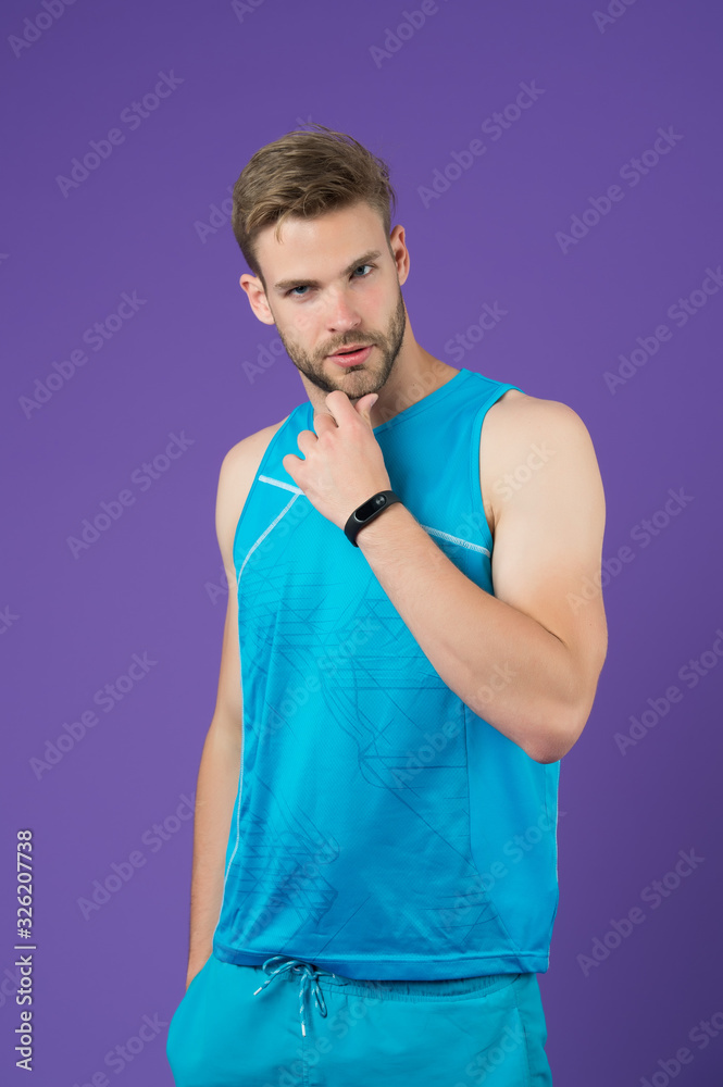 handsome man touch beard. man in sportswear. muscular guy purple background. Portrait of attractive athlete. fit man relax after exercising in gym. male fitness fashion. fitness and healthy lifestyle. handsome man touch beard. man in sportswear. muscular guy purple background. Portrait of attractive athlete. fit man relax after exercising in gym. male fitness fashion. fitness and healthy lifestyle.