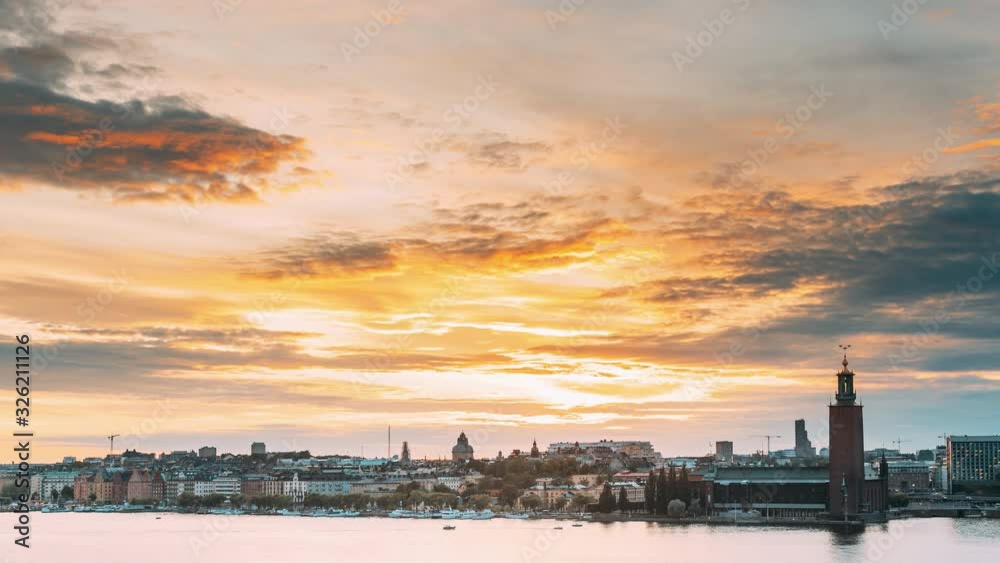 Stockholm, Sweden. Skyline Cityscape Famous View Of Old Town Gamla Stan In Summer Evening. Famous Popular Destination Scenic UNESCO World Heritage Site. Popular City Hall, Riddarholm Church In Sunset. Stockholm, Sweden. Skyline Cityscape Famous View Of Old Town Gamla Stan In Summer Evening. Famous Popular Destination Scenic UNESCO World Heritage Site. Popular City Hall, Riddarholm Church In Sunset.