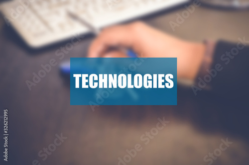 Technologies word with blurring business background