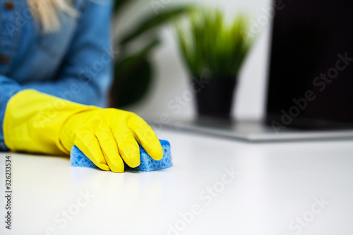 Close Up cleaning company worker hand holding sponge