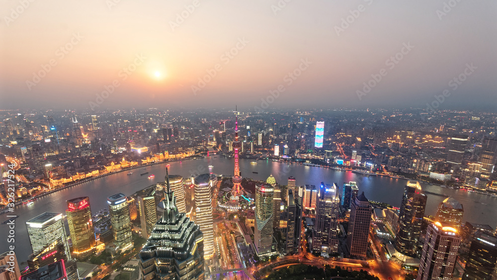 High angle view of Shanghai skyline in sunset with lights on, beautiful modern cityscape.