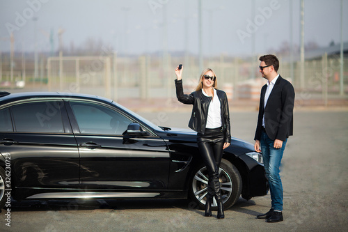 Happy young couple chooses and buying a new car for the family © Maksymiv Iurii