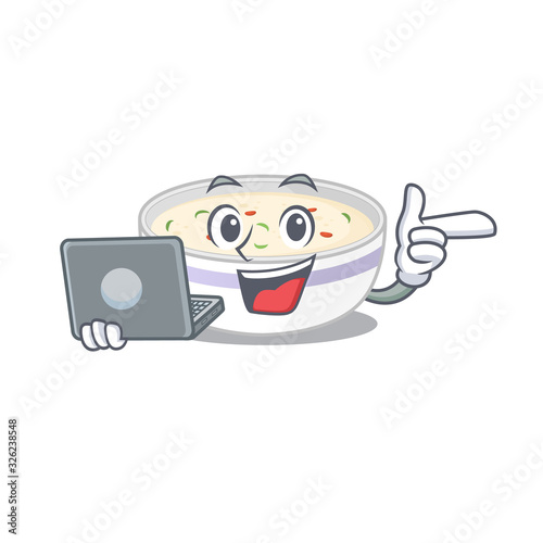 Cool character of steamed egg working with laptop photo