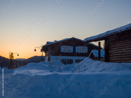 Dawn in the ski resort Mountain Salanga. Lyrical winter landscape. Frosty morning in Siberia photo