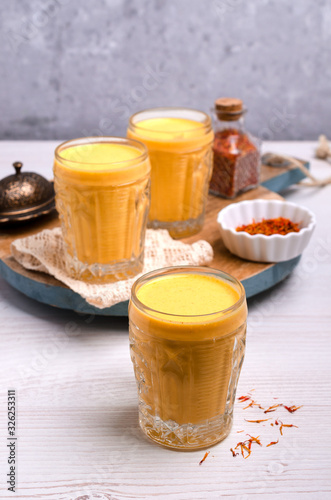 Yellow smoothie in glass