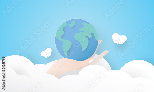 Paper art of beautiful hand holding earth, Earth Day, Environment concept