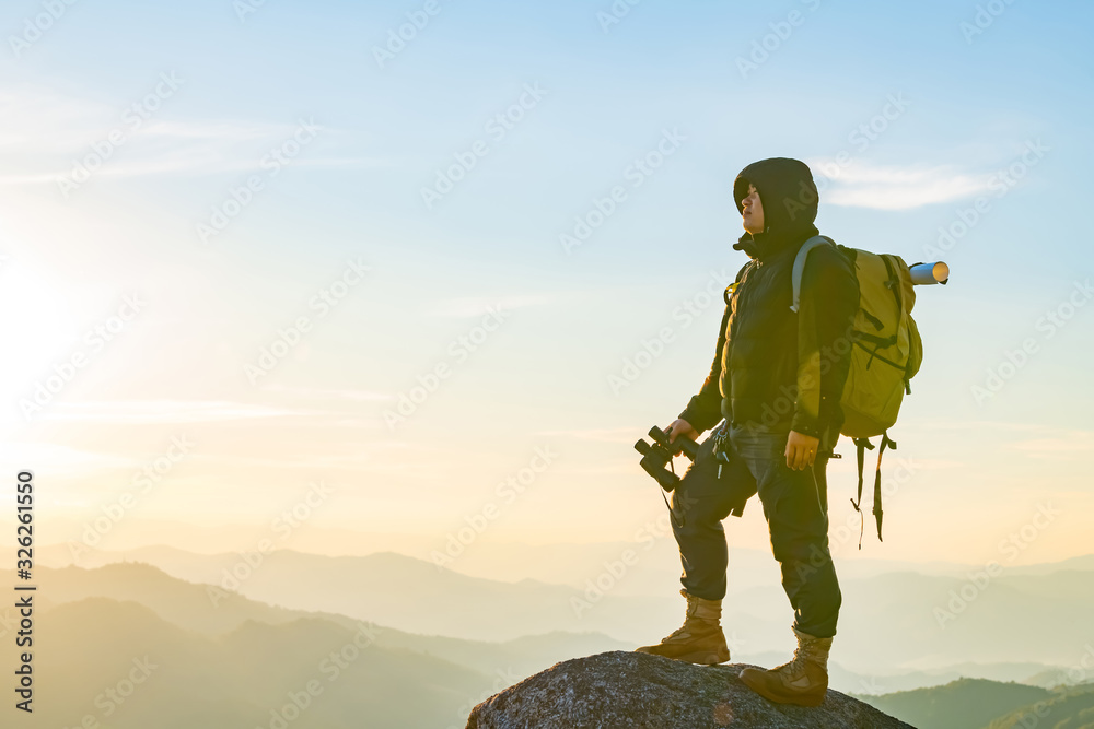 Φωτογραφία Young Man Traveler with backpack relaxing outdoor with rocky mountains on background Summer vacations and Lifestyle hiking concept
