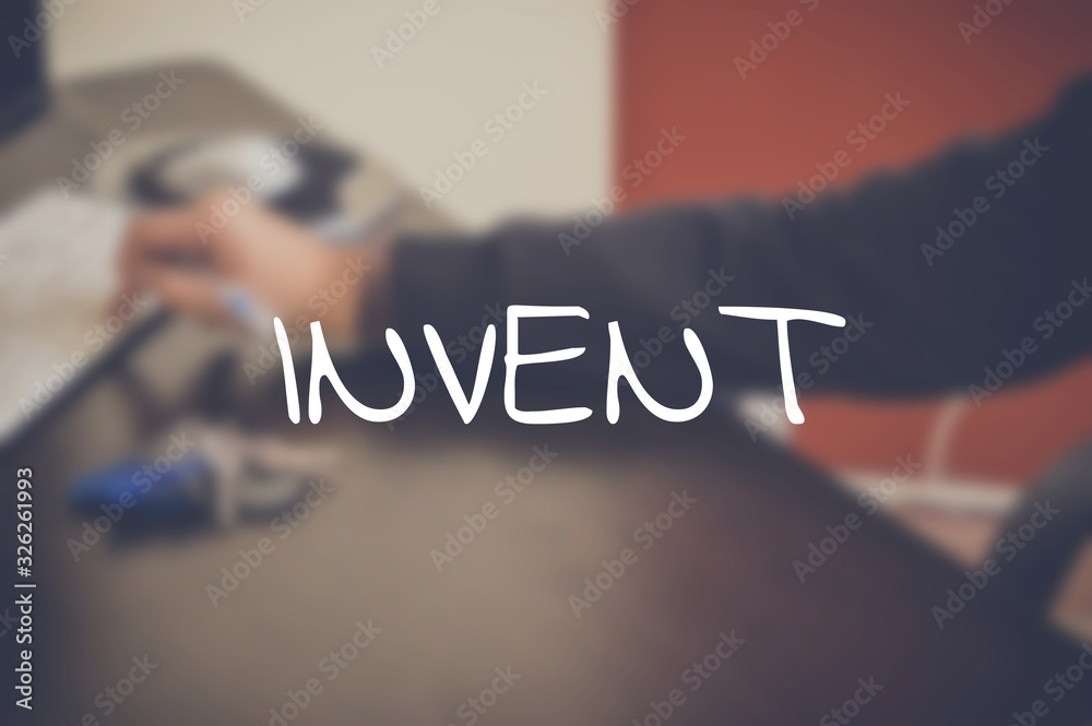 Invent word with business blurring background Invent word with business blurring background