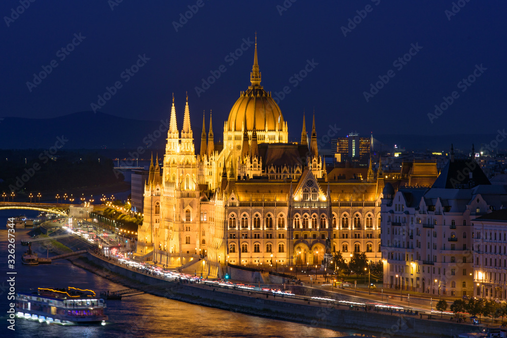 Fototapeta premium Night view of Hungarian Parliament Building on the banks of the Danube, Budapest, Hungary