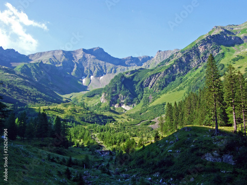 View of the Ratikon border alpine mountain massif or Rätikon Grenzmassiv (oder Raetikon) from Liechtenstein Alps - Steg, Liechtenstein photo