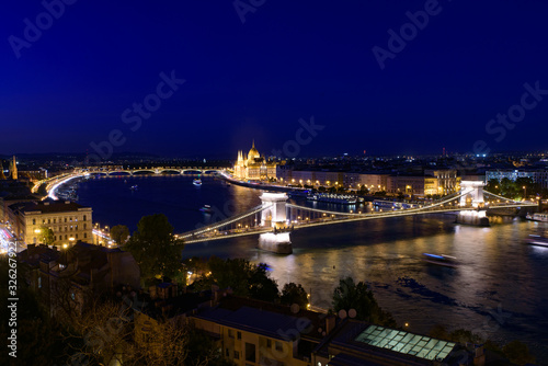 Night panorama of Hungarian Parliament Building  Sz  chenyi Chain Bridge  and River Danube in Budapest  Hungary