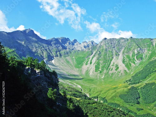 View of the Ratikon border alpine mountain massif or Rätikon Grenzmassiv (oder Raetikon) from Liechtenstein Alps - Steg, Liechtenstein photo