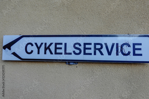 Norrtalje, Sweden A sign in Swedish giving directions to a bicycle workshop.