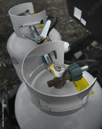 Cuadro en lienzo Two 20 pound propane tanks secured to the front of an RV travel Trailer