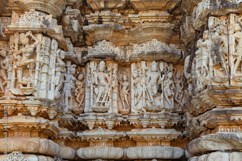 Indian stone artwork and sculptures on the walls of a ancient Jain temple at Chittorgarh Fort Rajasthan