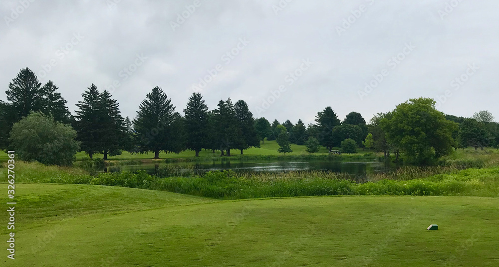 golf course tee pond blue sky