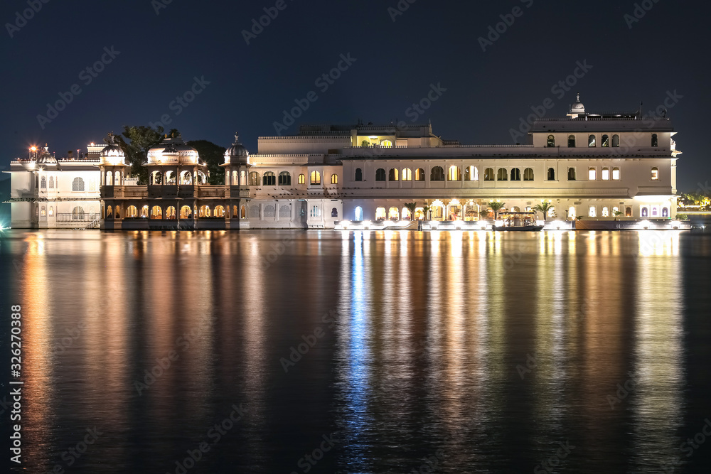 Palace architecture on lake Pichola at night with water reflection at Udaipur rajasthan