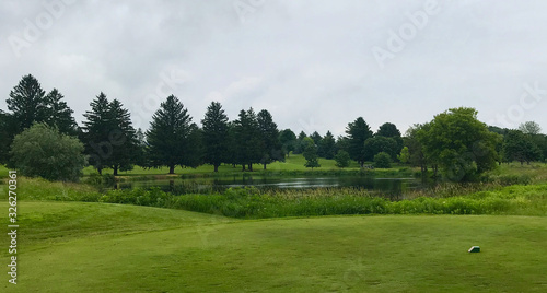 golf course tee pond blue sky