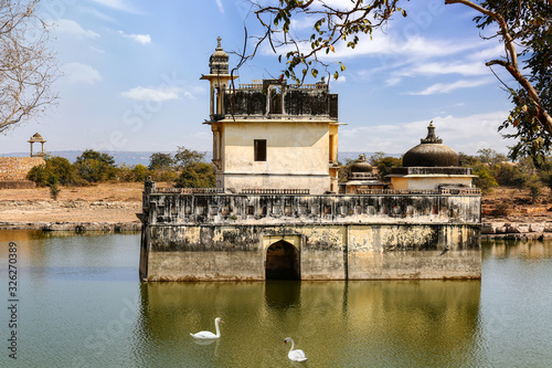 Medieval ruins of queen Padmini palace isolated in the middle of a lake at Chittorgarh Fort Rajasthan photo