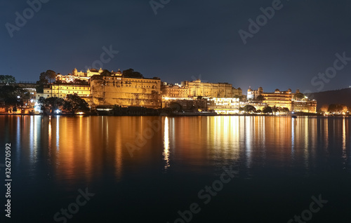 Udaipur City Palace at night beside Lake Pichola at Rajasthan  India