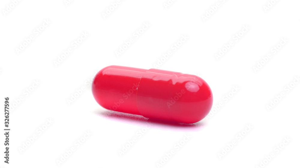 red capsule isolated on a white background. medical capsule