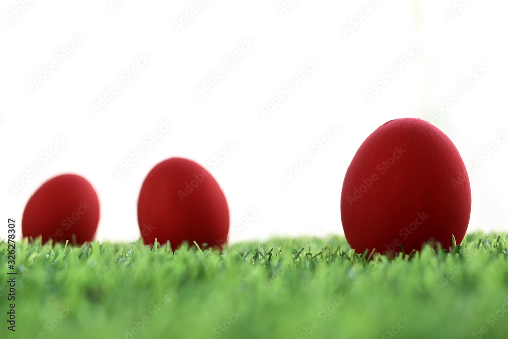 red easter egg on lawn green grass artificial with blank white background