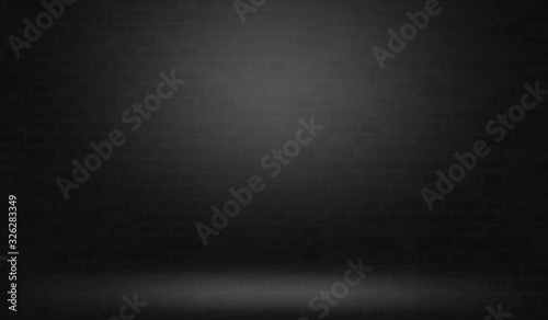 Black brick wall background with light effect.