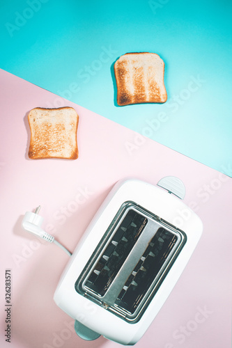 toaster with toasted bread for Breakfast. vertical photo Flat lay
