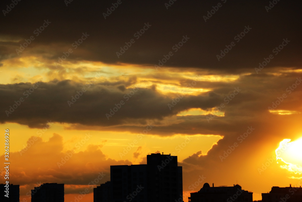 Sunrise at the city. Silhouette of buildings.