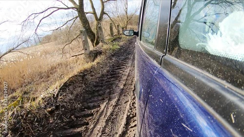 The vehicle traveling on the road, slow motion on the camera action.