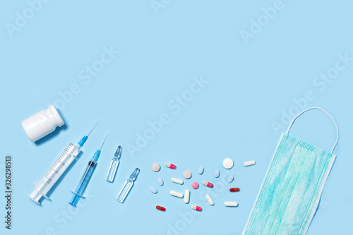 Medical pills and capsules in packs, an injector syringe