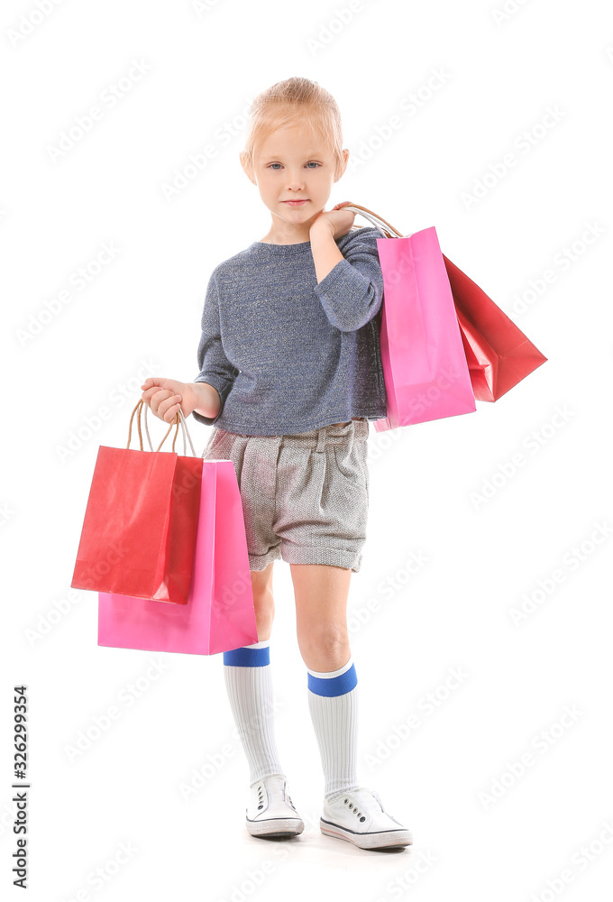 Cute little girl with shopping bags on white background Cute little girl with shopping bags on white background