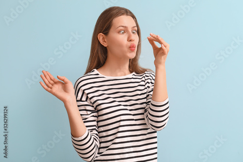 Funny young woman with chew...