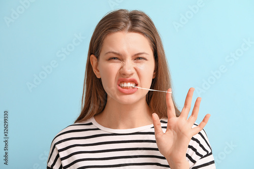 Funny young woman with chew...