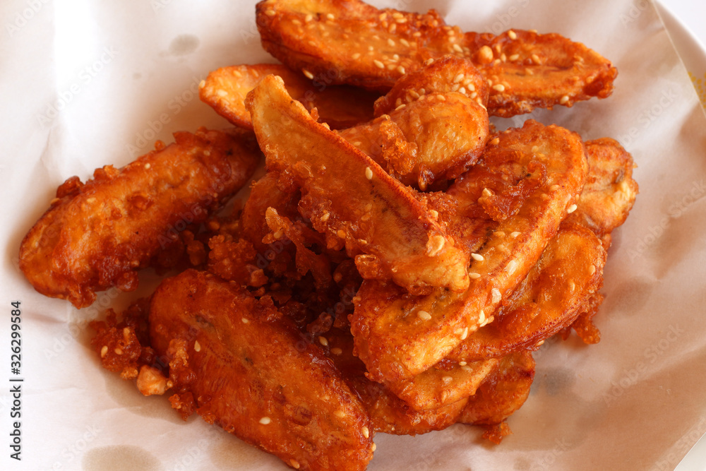 Close up Thai snack sweetened fried banana fritters. Close up Thai snack sweetened fried banana fritters.