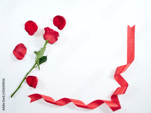 Single red rose with red ribbon.