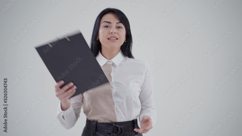 Studio portrait of angry businesswoman. Portrait of businesswoman on grey background Studio portrait of angry businesswoman. Portrait of businesswoman on grey background