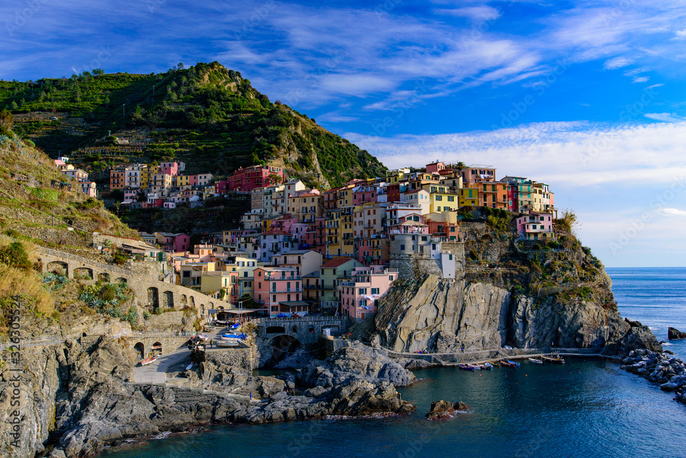 Manarola, one of the five Mediterranean villages in Cinque Terre, Italy, famous for its colorful houses and harbor