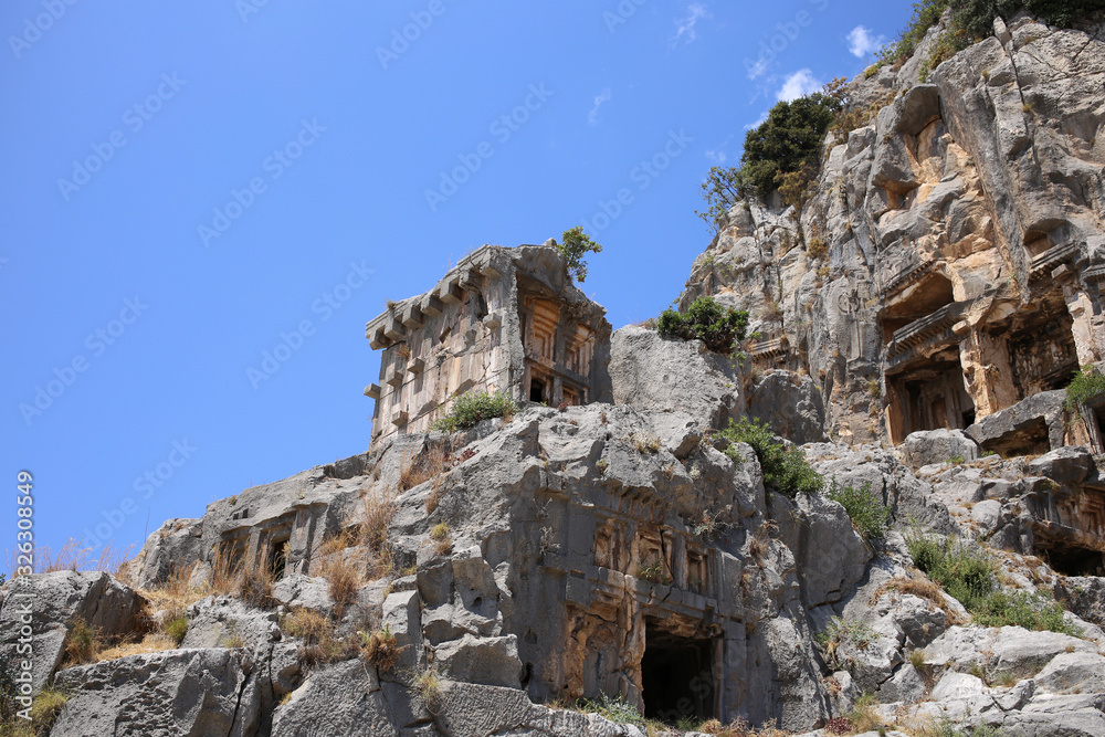 A large ancient tomb on a mountain in the ancient city of Myra in Turkey.